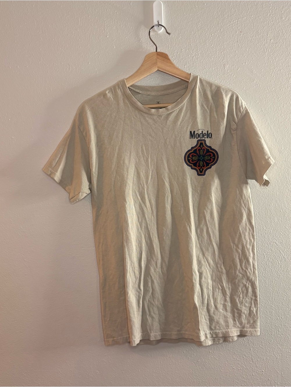 ModelCo Cream Short Sleeve Tee with Decorative Chest Emblem